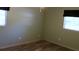 Bedroom with wood-look flooring and light green walls at 7116 Kingsbury Cir, Tampa, FL 33610