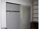 Reach-in closet with shelves and hanging rod at 7116 Kingsbury Cir, Tampa, FL 33610
