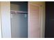 Reach-in closet with sliding doors and upper shelf at 7116 Kingsbury Cir, Tampa, FL 33610