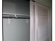 Reach-in closet with sliding doors, shelf, and hanging rod at 7116 Kingsbury Cir, Tampa, FL 33610