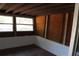 Enclosed Florida room with large windows, wood ceiling and red floor at 7116 Kingsbury Cir, Tampa, FL 33610