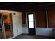 Florida room with a window AC unit, door to backyard, and access to other rooms at 7116 Kingsbury Cir, Tampa, FL 33610