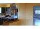 Kitchen with dark cabinets, light countertops, and black appliances at 7116 Kingsbury Cir, Tampa, FL 33610