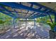Covered back patio with wood decking and string lights at 7471 35Th N St, Pinellas Park, FL 33781