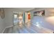 Serene bedroom with gray walls, wood-look floors and mirrored closet at 7471 35Th N St, Pinellas Park, FL 33781