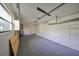 Spacious garage with overhead storage and ample room for parking and storage at 7471 35Th N St, Pinellas Park, FL 33781