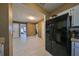 Modern kitchen featuring a black refrigerator and white cabinetry at 7471 35Th N St, Pinellas Park, FL 33781