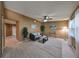 Bright and airy living room with tiled floors, a ceiling fan, and comfortable seating at 7471 35Th N St, Pinellas Park, FL 33781