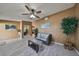 Living room with tiled floors, a ceiling fan and large plant at 7471 35Th N St, Pinellas Park, FL 33781
