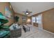Cozy living room featuring a ceiling fan, light walls, and a neutral colored rug at 7471 35Th N St, Pinellas Park, FL 33781