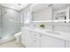Double vanity bathroom with a walk-in shower and bathtub at 819 59Th Ave, St Pete Beach, FL 33706