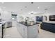 Open concept kitchen features a large island and breakfast bar at 819 59Th Ave, St Pete Beach, FL 33706