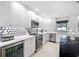 Bright kitchen with custom cabinetry, sleek countertops, and high-end stainless steel appliances at 819 59Th Ave, St Pete Beach, FL 33706