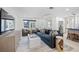 Bright and airy living area featuring a large TV and comfortable seating at 819 59Th Ave, St Pete Beach, FL 33706