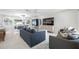 Open floor plan with modern furniture and large windows at 819 59Th Ave, St Pete Beach, FL 33706