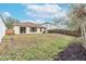 Spacious backyard with a large grassy area at 10615 Dawns Light Dr, Riverview, FL 33578