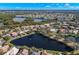 Aerial view of neighborhood with lake and waterfront access at 1160 Darlington Oak Ne Dr, St Petersburg, FL 33703