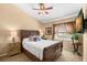 Spacious bedroom with wood bed frame and a ceiling fan at 1160 Darlington Oak Ne Dr, St Petersburg, FL 33703