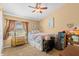 Inviting bedroom featuring a ceiling fan, window and carpet at 1160 Darlington Oak Ne Dr, St Petersburg, FL 33703