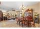Open dining room with hardwood furniture and a view to the living room at 1160 Darlington Oak Ne Dr, St Petersburg, FL 33703