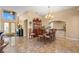 Elegant dining room featuring a beautiful chandelier and a classic wood china cabinet at 1160 Darlington Oak Ne Dr, St Petersburg, FL 33703