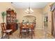 Formal dining room with a hutch and chandelier, ideal for Gathering gatherings and entertaining at 1160 Darlington Oak Ne Dr, St Petersburg, FL 33703