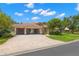 Beautiful home featuring a tile roof, brick driveway, landscaping, and a two-car garage at 1160 Darlington Oak Ne Dr, St Petersburg, FL 33703