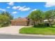Inviting two-story home with a three-car garage and a lush green lawn at 1160 Darlington Oak Ne Dr, St Petersburg, FL 33703