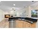 Well-lit kitchen with stainless steel appliances and granite countertops, offering a view of the living room at 1160 Darlington Oak Ne Dr, St Petersburg, FL 33703