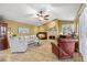 Comfortable living room featuring tile floors, a fireplace, and stylish furniture at 1160 Darlington Oak Ne Dr, St Petersburg, FL 33703