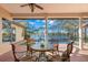 Relaxing screened patio overlooking a sparkling pool and tranquil lake at 1160 Darlington Oak Ne Dr, St Petersburg, FL 33703