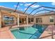Sparkling swimming pool surrounded by a screened enclosure and a scenic lake view at 1160 Darlington Oak Ne Dr, St Petersburg, FL 33703
