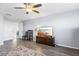 Living Room featuring a wooden cabinet and ceiling fan at 11938 Greenchop Pl, Riverview, FL 33579