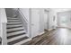 Modern staircase with grey and white wooden steps at 11938 Greenchop Pl, Riverview, FL 33579