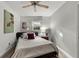 A comfortable bedroom featuring a ceiling fan and soft lighting at 1515 W Meadowbrook Ave, Tampa, FL 33612