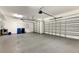 Two-car garage with storage shelves and garage door opener at 1533 Emerald Dunes Dr, Sun City Center, FL 33573