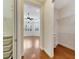 Hallway with built-in shelving units and view of bedroom at 1533 Emerald Dunes Dr, Sun City Center, FL 33573