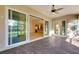 Screened porch with sliding glass doors leading to the kitchen and living area at 1533 Emerald Dunes Dr, Sun City Center, FL 33573