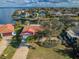 An aerial view of a home with a driveway and attached garage at 2084 Iowa Ne Ave, St Petersburg, FL 33703