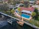 Private dock on a canal with a boat lift, attached to a house with a pool at 2084 Iowa Ne Ave, St Petersburg, FL 33703