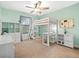 Charming bedroom with loft bed, desk area, and plenty of storage in mint green at 2378 Whittler Br, Odessa, FL 33556