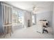 Spacious bedroom or office space with large windows, ceiling fan, and ample natural light at 2386 Sumatran Way # 34, Clearwater, FL 33763
