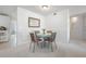 Small dining area with a round table and four chairs at 2386 Sumatran Way # 34, Clearwater, FL 33763