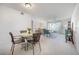 Dining area with round table and chairs, view into living room at 2386 Sumatran Way # 34, Clearwater, FL 33763