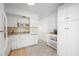 White kitchen with granite countertops and modern appliances at 2386 Sumatran Way # 34, Clearwater, FL 33763