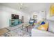 Living room with comfy seating, a large TV, and decorative accents at 2386 Sumatran Way # 34, Clearwater, FL 33763
