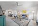 Living room featuring a neutral color palette, area rug, and comfy seating at 2386 Sumatran Way # 34, Clearwater, FL 33763