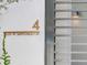 Brass plaque with the address number 4, 3020 W Santiago St on a white wall at 3020 W Santiago St # 4, Tampa, FL 33629