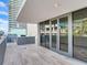 Private balcony with grey tile flooring and outdoor grill at 3020 W Santiago St # 4, Tampa, FL 33629