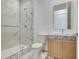 Modern bathroom with marble shower and light wood vanity at 3020 W Santiago St # 4, Tampa, FL 33629